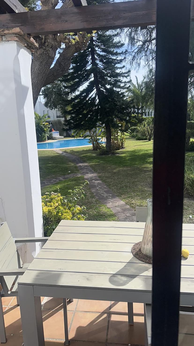 Garden table under pergola